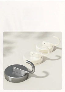 Detail of multi-colored heavy duty vacuum suction hooks in gray and beige finishes