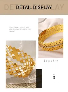 Detail view of gold-plated titanium steel bracelet with hollow geometric and leaf diamond inlay