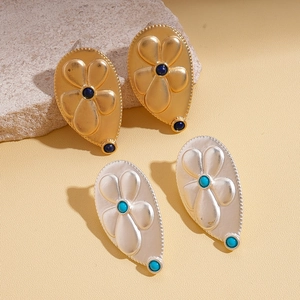 Metallic pleated flower drop earrings with blue gemstones in gold and silver finish