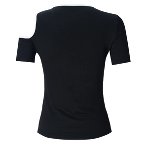 Detail view of the cold-shoulder cutout and white contrast piping on black knit top