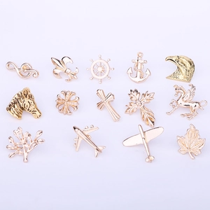Detailed collection of 14 gold metal lapel pins featuring maple leaf and airplane shapes