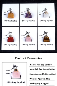 Detail showing natural gemstone charms in diverse colors with illustrated backing cards