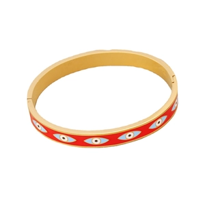 Golden evil eye bangle with red enamel finish and colorful protective charms