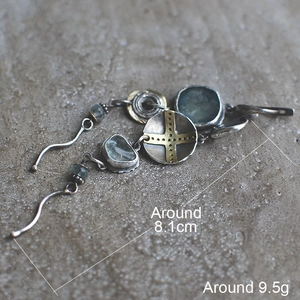 Vintage tribal asymmetric earrings with sky blue stones and metallic cross charms