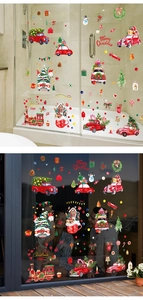 Christmas window decals showing festive truck and snowman on glass in day and night scenes