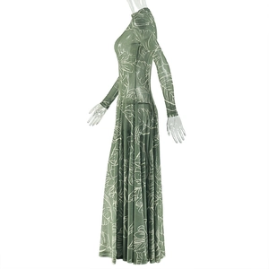 Detail of light green floral dress with tropical leaf prints and stand collar