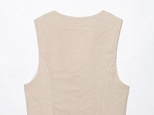 Close-up of beige beaded vest back detail showing high-quality linen fabric texture