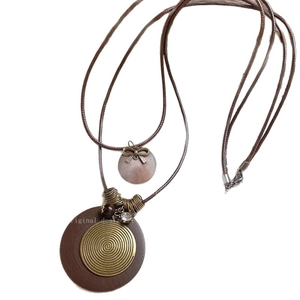Ethnic retro long necklace featuring wooden pendant and metallic feather star accents