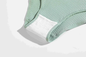 Detailed close-up of breathable cotton crotch and ribbed knit fabric of women panties