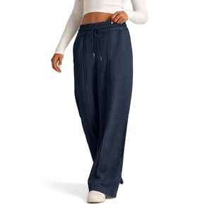 Detail of high waisted wide leg trousers with adjustable drawstring and vertical seam