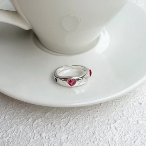 Detailed macro view of S925 silver ring featuring pink heart gemstone and textured band