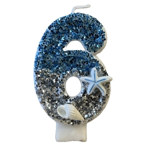 Blue and silver number 6 ocean-themed birthday candle with glitter and seashells
