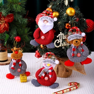 Christmas plush ornaments set including Santa, bear, reindeer, and snowman dolls on a tree