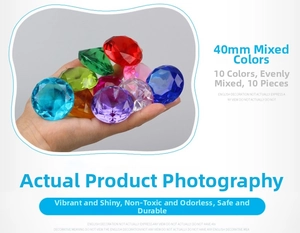 Macro shot of 40mm multicolored acrylic crystal diamonds held in hand for size scaling