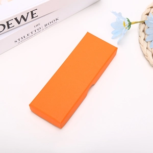 Detailed view of an orange textured jewelry gift box set in a modern lifestyle scene