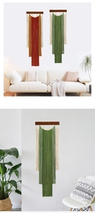 Detail of bohemian gradient fringe tapestry with wooden rod on a white wall