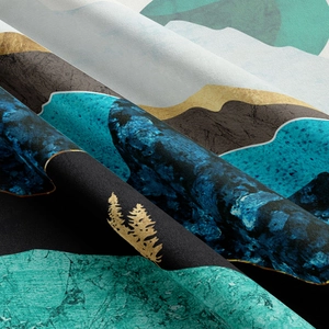 Detailed view of the velvet fabric texture and abstract mountain landscape print