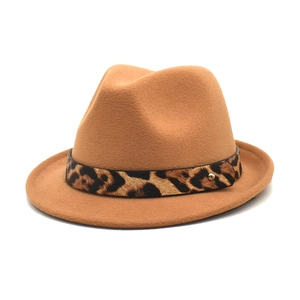 Detail of camel wool fedora hat featuring leopard print band and golden metal rivet