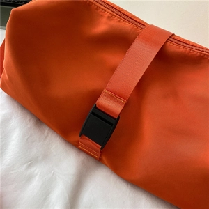 Vibrant orange Oxford cloth crossbody bag featuring black buckle and high-quality zipper