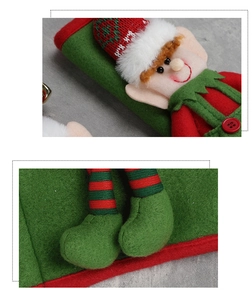 Close-up of Christmas elf refrigerator handle cover with red buttons and felt details