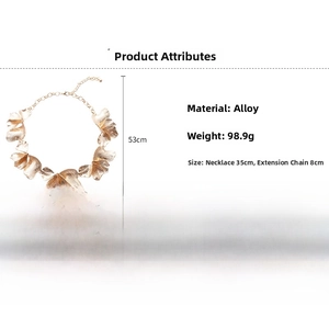 Detail showing gold flower petal necklace with brushed metal texture and size dimensions