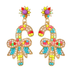 Detailed macro view of colorful candy cane earrings with pearls and ribbon design