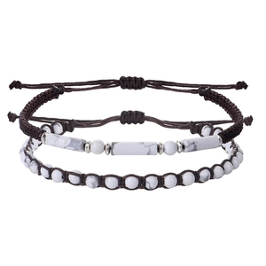 Detail of adjustable braided bead bracelets with marble stones and cylindrical charm