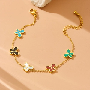 Gold chain bracelet with five multicolored butterfly charms and adjustable lobster clasp