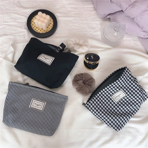Three-piece set of black and checkered cotton cosmetic bags with Time to Party labels
