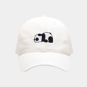 Close-up of cute panda embroidery on a white cotton baseball cap with clean stitching