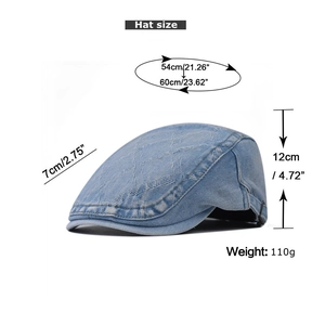 Detail view of light blue denim flat cap with quilted texture and size specifications