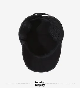 Detailed interior of men's winter flat cap featuring warm lining and foldable ear flaps
