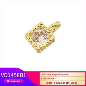 Detail of square gold plated brass pendant with cubic zirconia inlay measuring 5x8mm