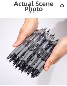 Detail showing high-capacity black gel pens with transparent barrels and soft grey grips
