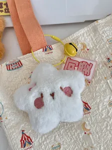 White plush star keychain with embroidery on a quilted circus bag, cute fluffy charm