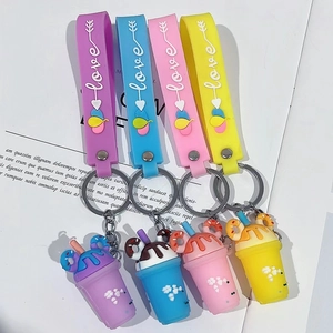 Close-up of colorful ice cream cup keychains with Love wristlets in vibrant silicone