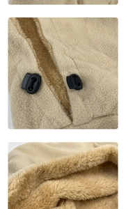 Detail of adjustable drawstring toggle and thick fleece lining on the beige winter hood