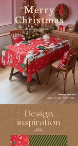 Detail of red Christmas tablecloth with Santa Claus motifs and matching holiday pillows