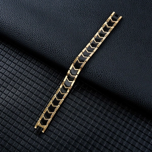 Men's titanium steel magnetic bracelet with golden V-shaped geometric links on black leather