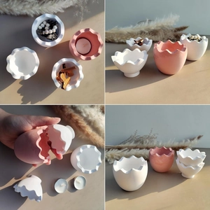 Detailed views of eggshell-shaped resin molds in white and pink matte finishes