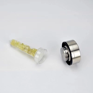 Detail of detachable inner cylinder with yellow crystal stones and stainless steel cap