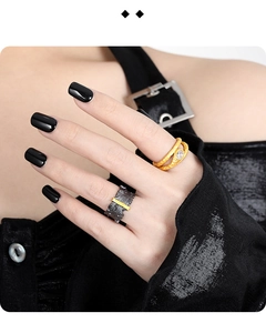 Detailed view of irregular texture black and gold plated S925 sterling silver rings