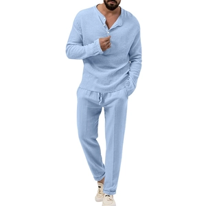 Detail view of light blue cotton linen set with long sleeve shirt and drawstring trousers