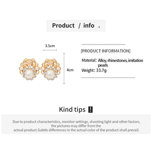 Detail view of vintage flower pearl earrings with dimensions 3.5cm by 4cm on white background