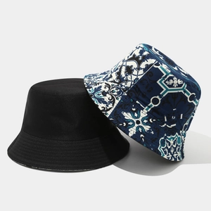 Detailed comparison of a plain black bucket hat and a vintage floral geometric print hat