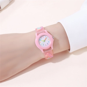 Close-up of pink silicone children watch strap with cute 3D butterfly and floral patterns