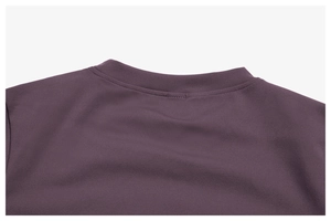 Macro shot of durable stitching on a dark purple brushed yoga top neckline detail