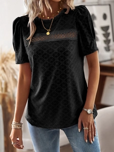 Detail of hollow out embroidery and lace patchwork on casual short sleeve black t-shirt