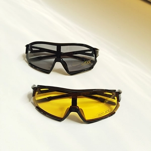 Detail view of punk geometric kids sunglasses with UV400 black and yellow lenses