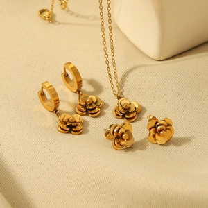 Elegant gold camellia jewelry set with flower necklace and rose gold earrings for women